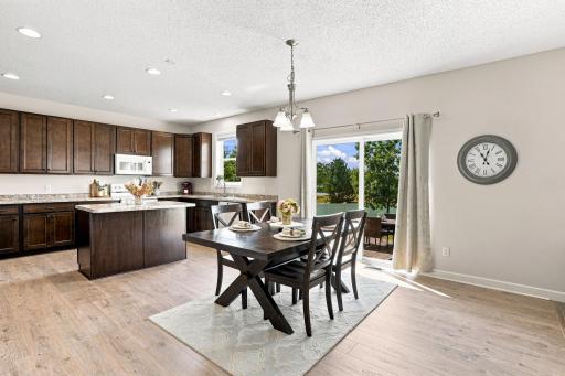 Sliding glass door opens to a level backyard.