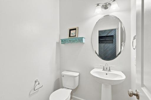 The main level is complete with a stylish half bath.