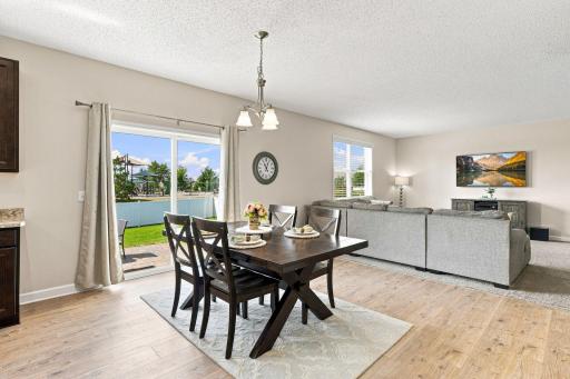 New wide-plank wood-look laminate flooring, rich wood-tone, durable and low maintenance.