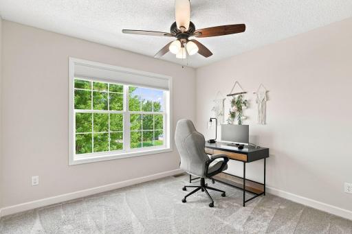 The fourth upper-level bedroom provides versatile space that can easily adapt to your lifestyle needs.