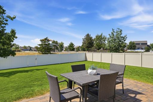 The backyard offers the perfect setting for grilling, entertaining, and making memories outdoors.