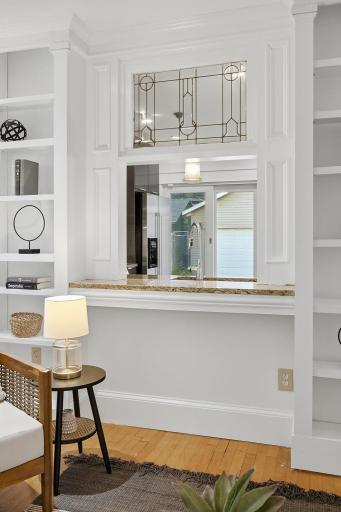 Pass through window from the living room to the kitchen. Custom lead glass window.