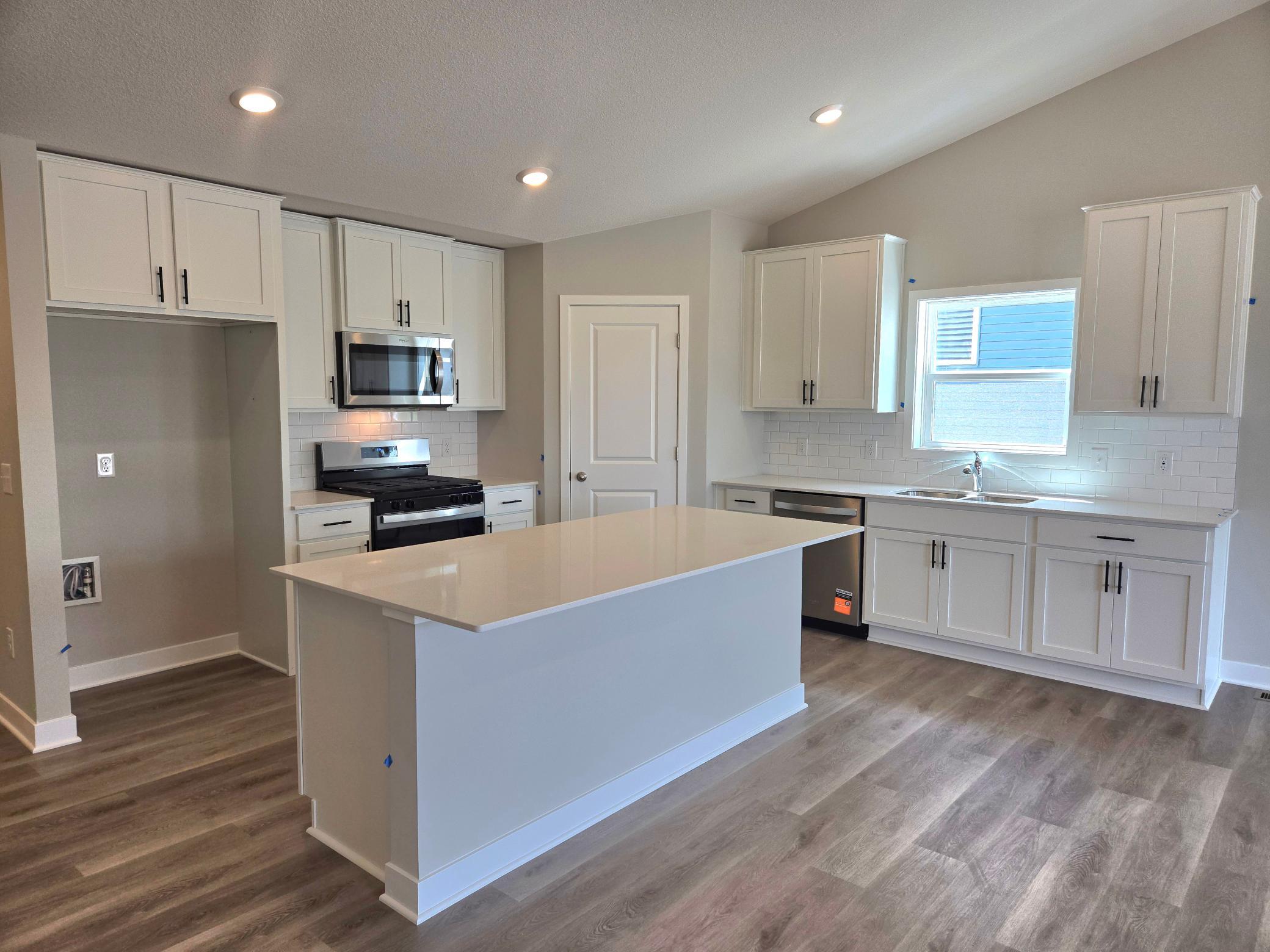The Finnegan Kitchen at Highlands at Eagle View in Elko New Market. Photo is of actual home. Options and colors may vary. Ask Sales Agent for details.