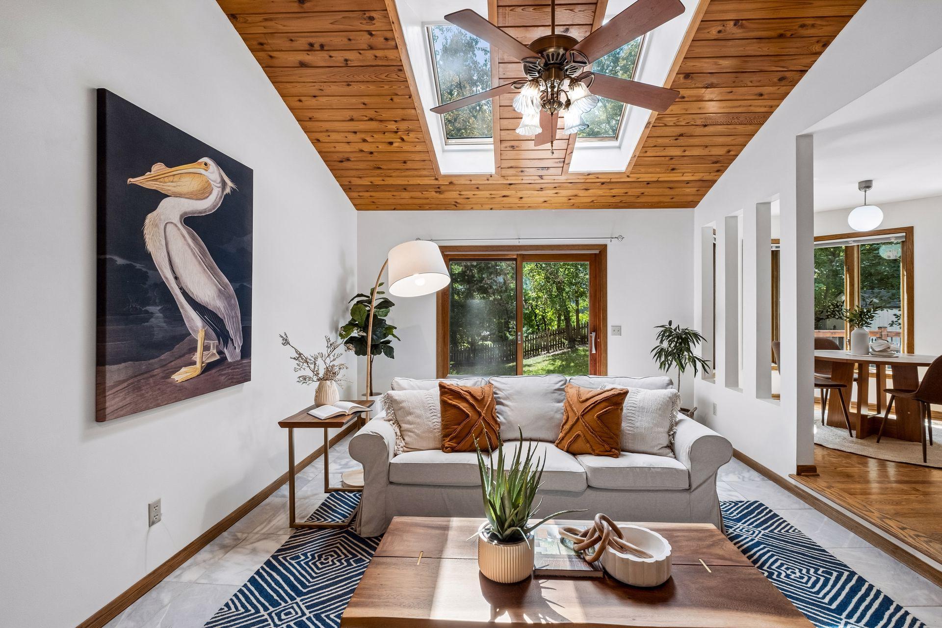 Dual skylights fill this main level family room with natural light and warmth.