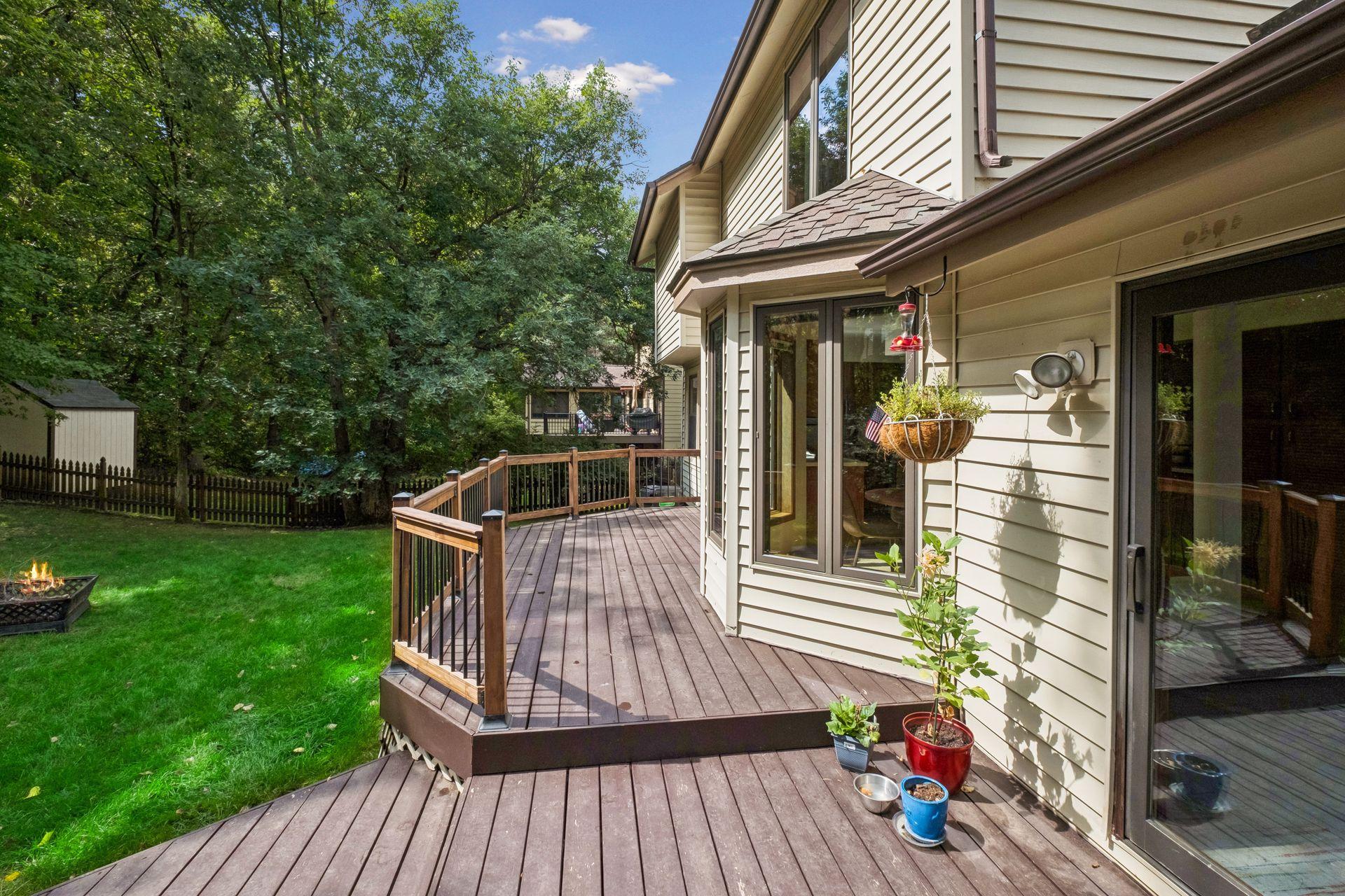 Convenient access to the deck and backyard from both the sunroom and family room, perfect for outdoor entertaining.