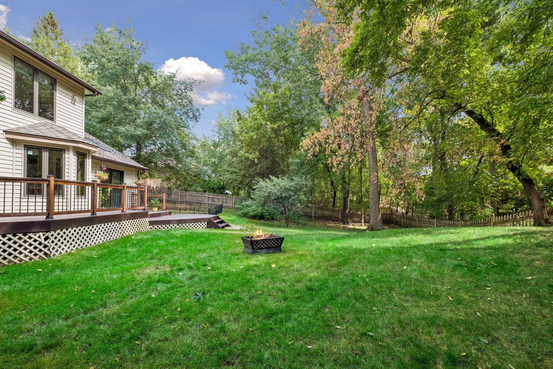 Spacious and private backyard surrounded by mature trees