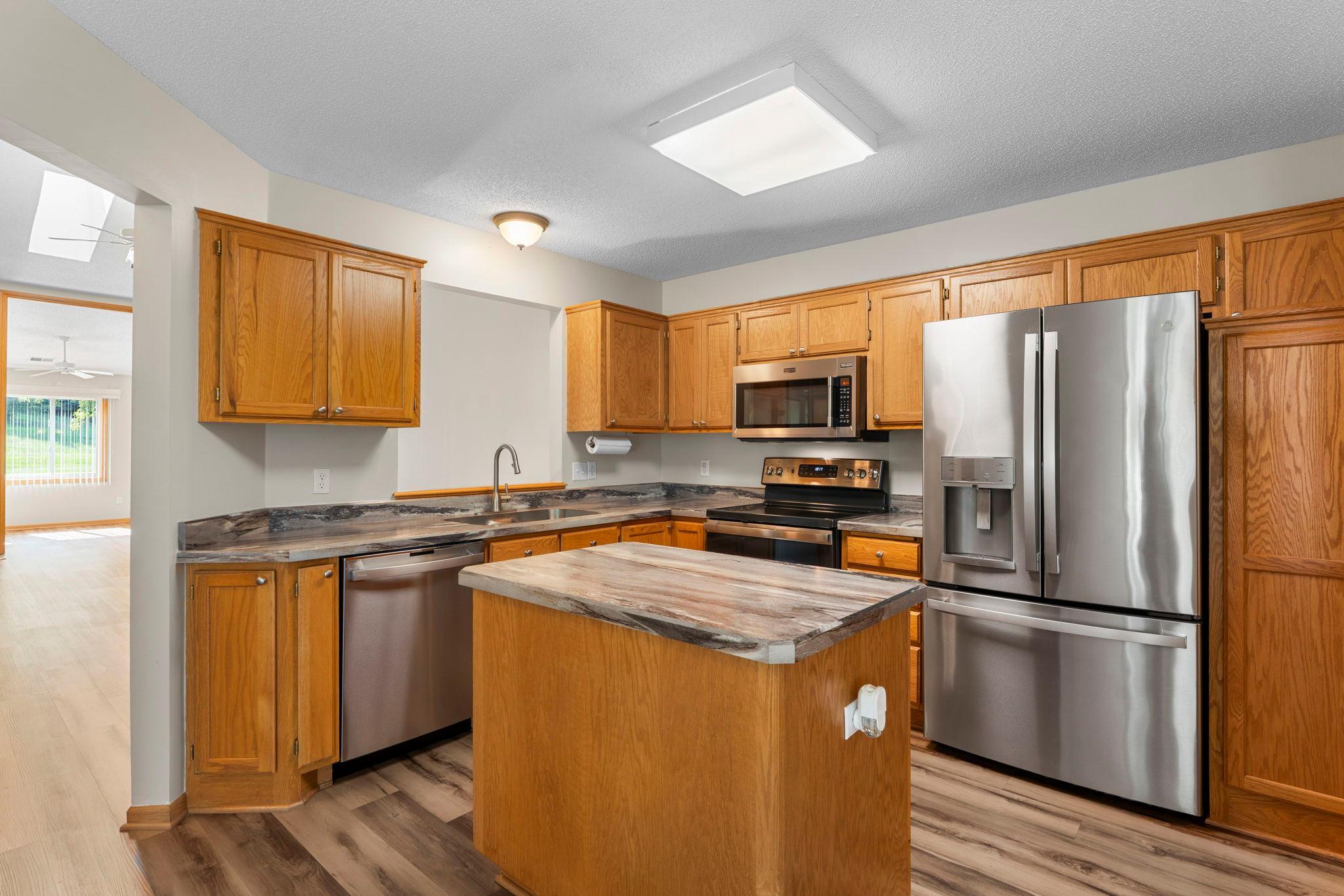 Spacious kitchen with ample storage and counter space.