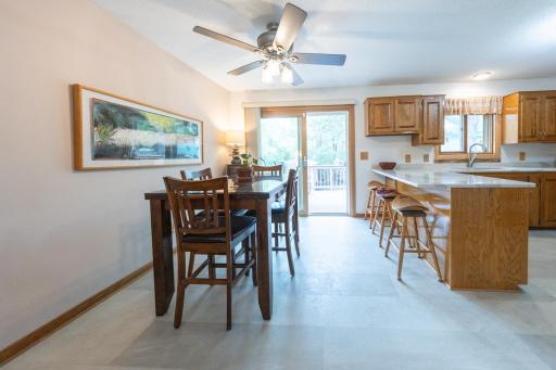 Comfortable dining space with sliding doors to the two-level deck.