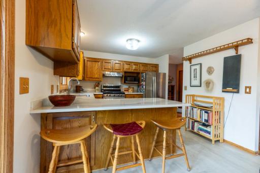 Quartz countertops and convenient breakfast-bar seating.