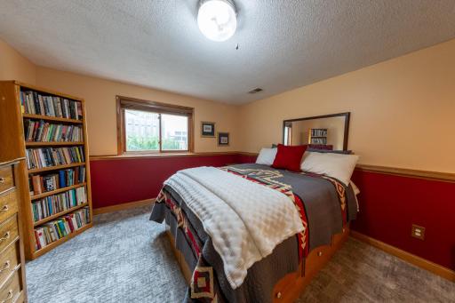 Private, lower level 3rd bedroom offering flexibility for guests, work, or hobbies.