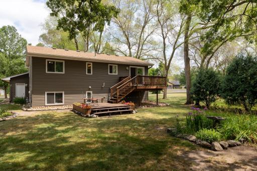 Two-level deck, mature trees, and a peaceful, private setting.