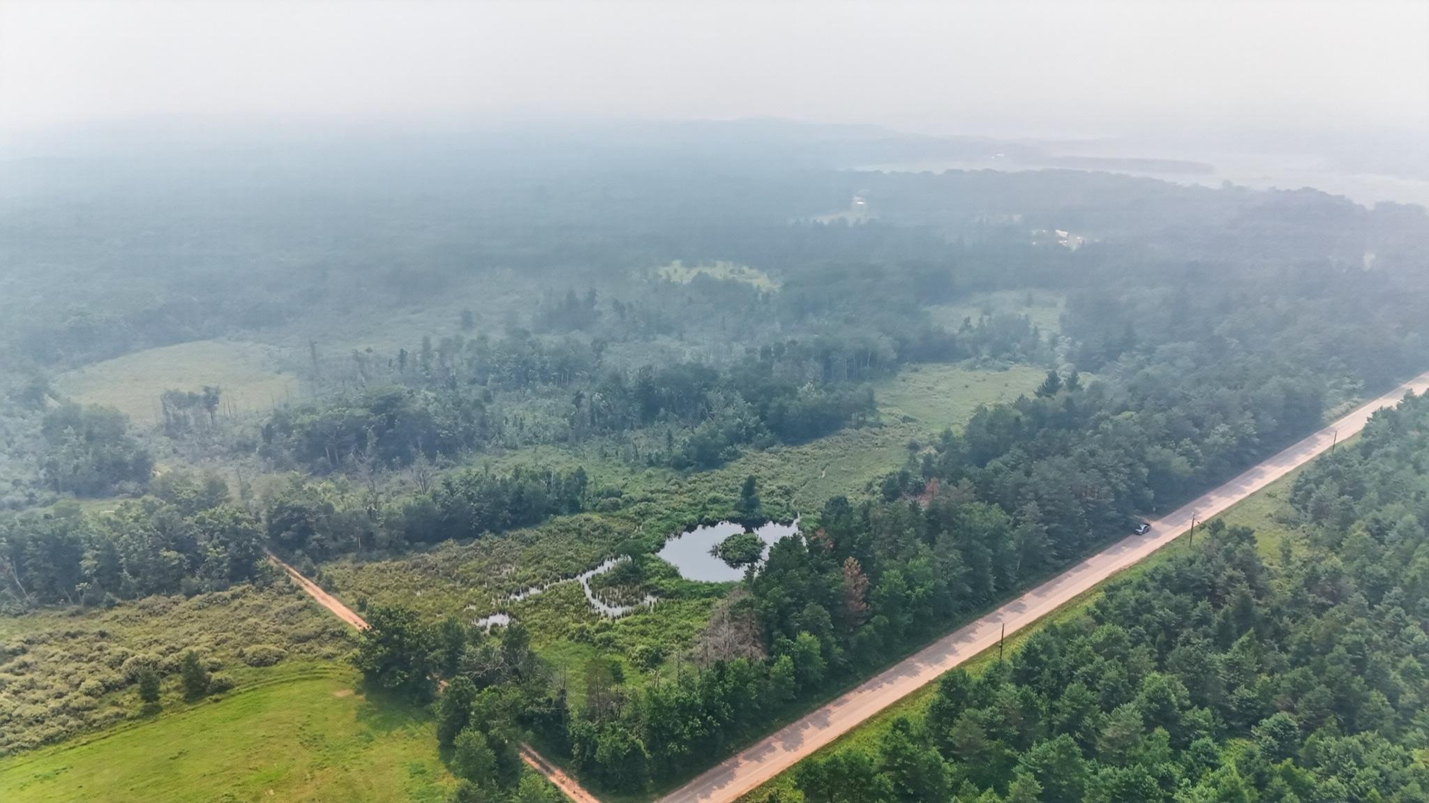 View of property from Northeast corner, smoky skies