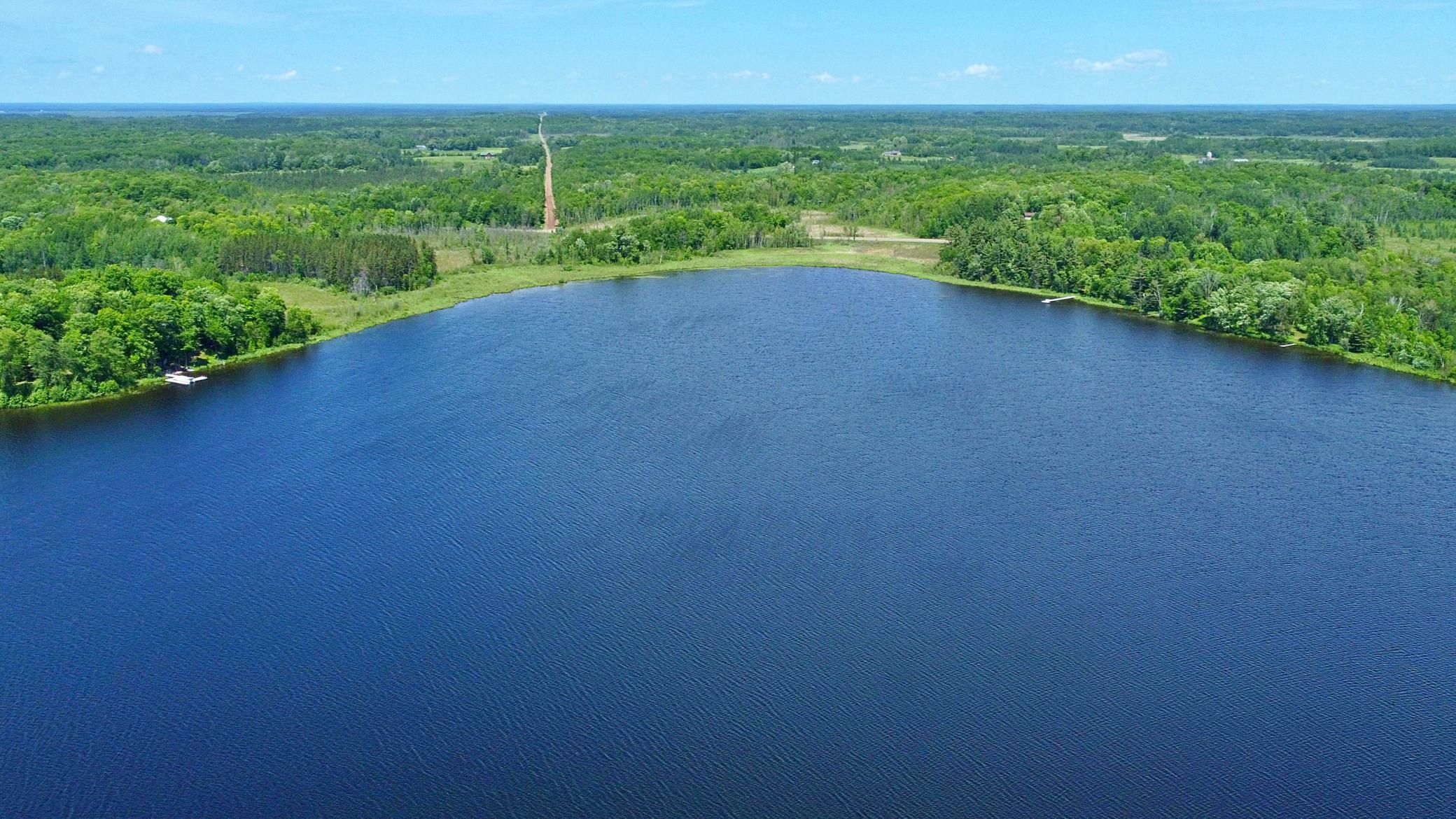 Aerial view of Section Twelve Lake with 950ft of shoreline for property