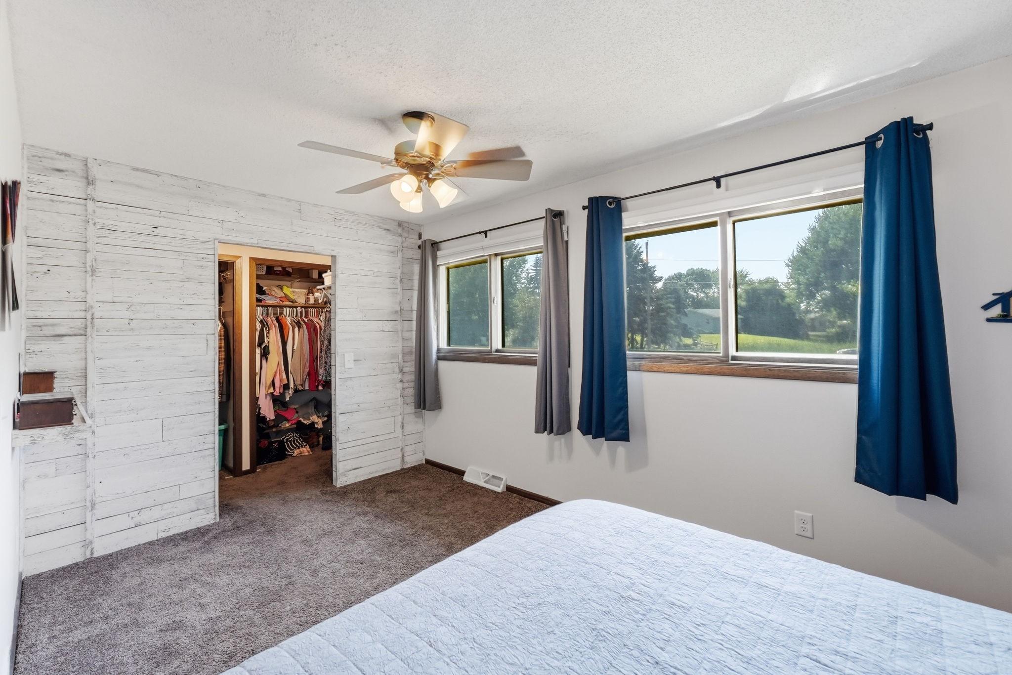 Bedroom with walk-in closet