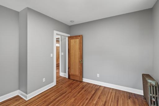 View of the bedroom from the corner looking towards the bedroom entrance.
