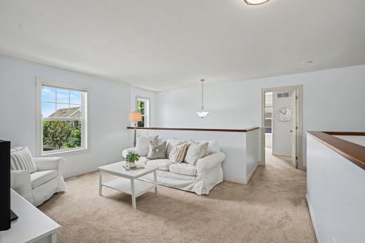 Upper level loft offers another space for a TV, gameroom or office.