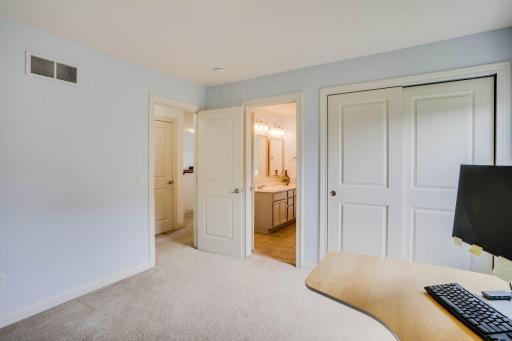 Another picture of the 2nd bedroom with views of the attached bathroom