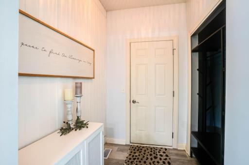 Mud Room off kitchen with a large open closet and garage access