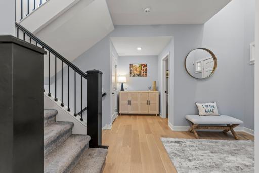Spacious front entry foyer and powder room.