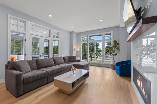A beautifully appointed living room looking out over White Bear Lake.