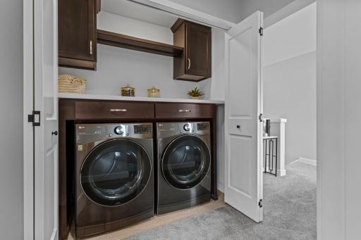 Convenient upper level laundry.