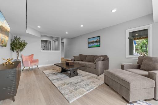 The comfortable lower-level family room designed for movie nights, game days and relaxed family time.