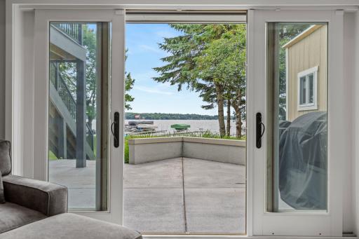 A walkout lower level opens naturally to the large patio spaces and backyard, adding flexible living space and another way to experience the lakefront setting.