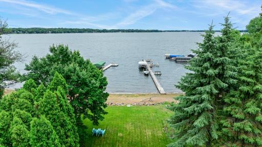 Beautiful views across White Bear Lake highlight the exceptional setting and gentle shoreline approach.