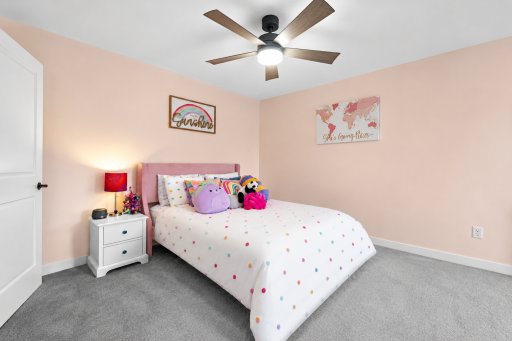 Upper level bedroom is generous in size.