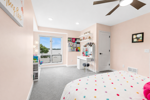 The bedroom also features a walk-in closet and western views of the lake.