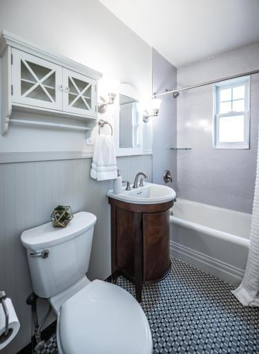 Adjacent to the main level bedroom is a full bath