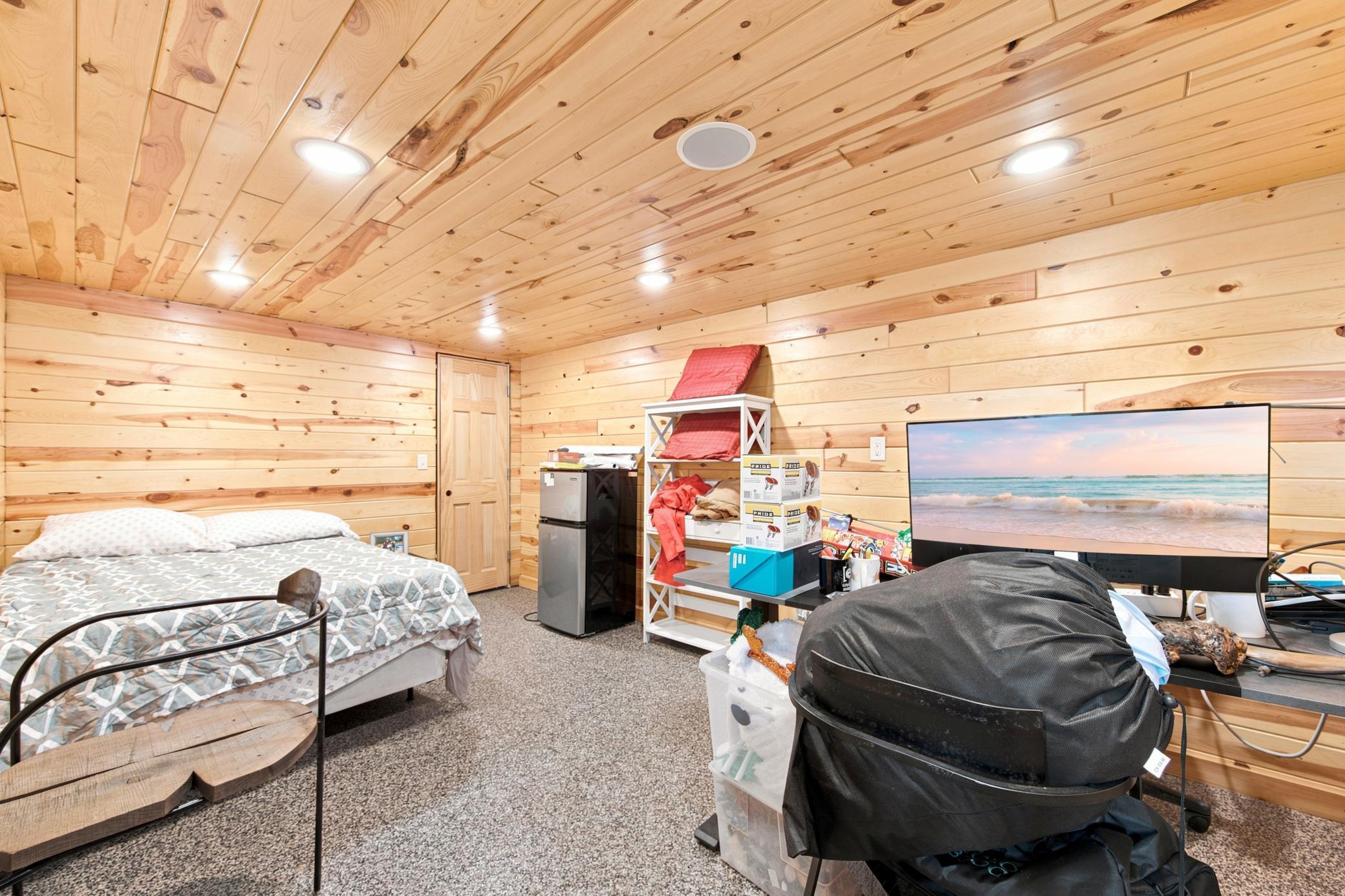 A massive outbuilding offers heated epoxy floors, incredible storage, full kitchen, bathroom with laundry , loft area, workshop space alongside a dedicated chicken coop.