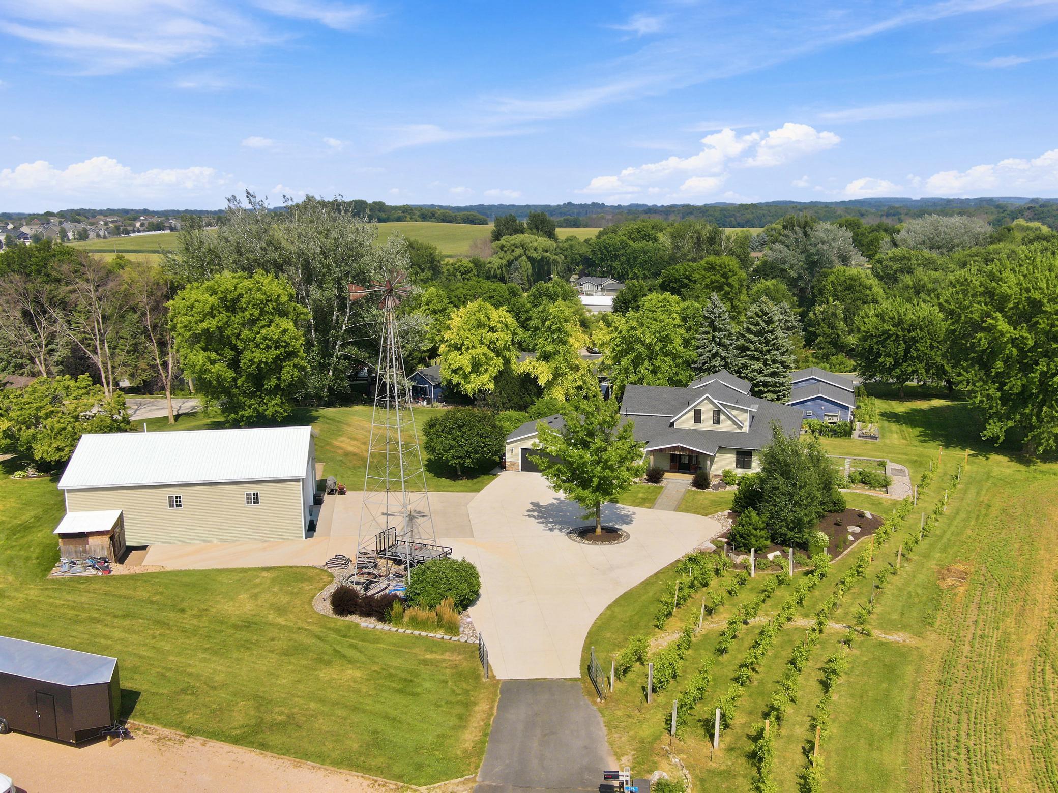 This breathtaking property features a beautifully updated home, a detached garage, a massive outbuilding, and its own private vineyard nestled on a sprawling lot with sweeping countryside views.