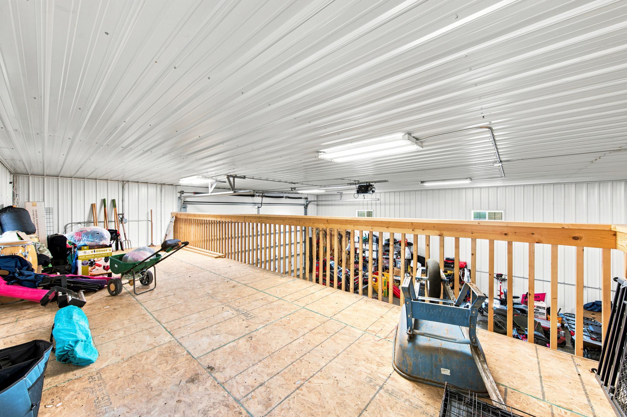 A massive outbuilding offers heated epoxy floors, incredible storage, full kitchen, bathroom with laundry , loft area, workshop space alongside a dedicated chicken coop.