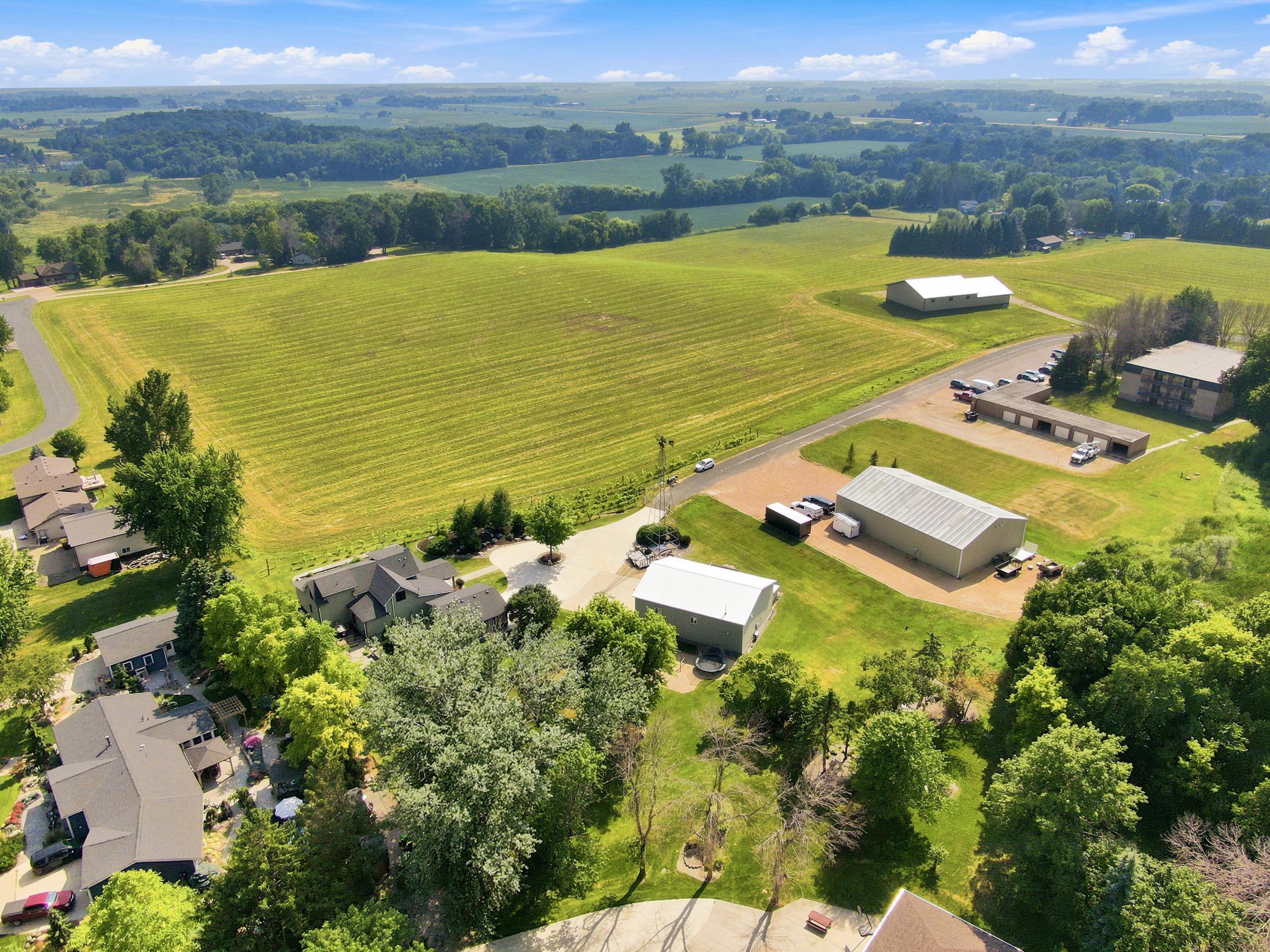 This breathtaking property features a beautifully updated home, a detached garage, a massive outbuilding, and its own private vineyard nestled on a sprawling lot with sweeping countryside views.