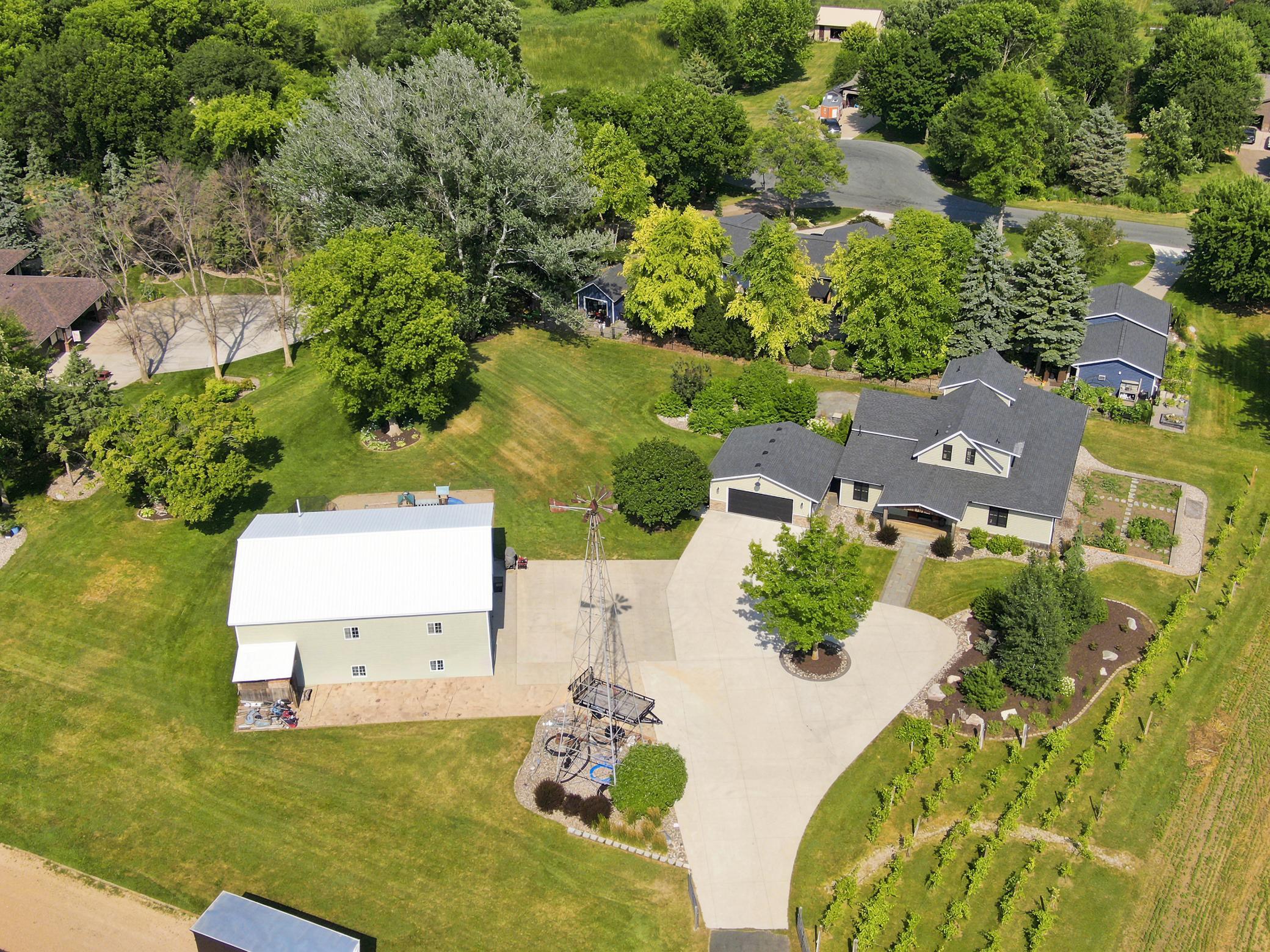 This breathtaking property features a beautifully updated home, a detached garage, a massive outbuilding, and its own private vineyard nestled on a sprawling lot with sweeping countryside views.