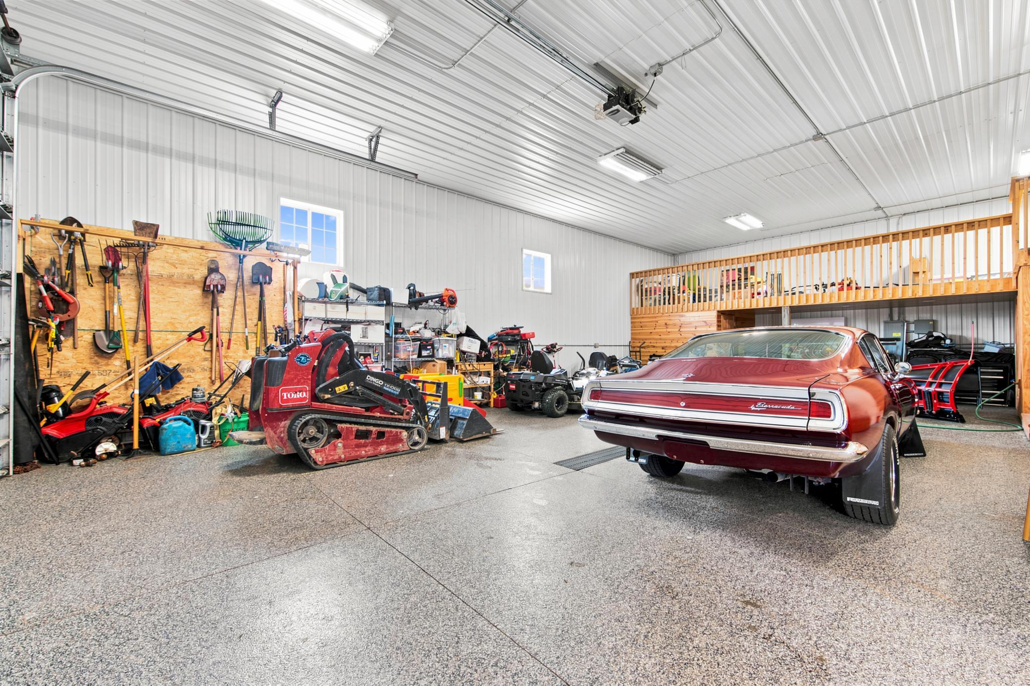 A massive outbuilding offers heated epoxy floors, incredible storage, full kitchen, bathroom with laundry , loft area, workshop space alongside a dedicated chicken coop..