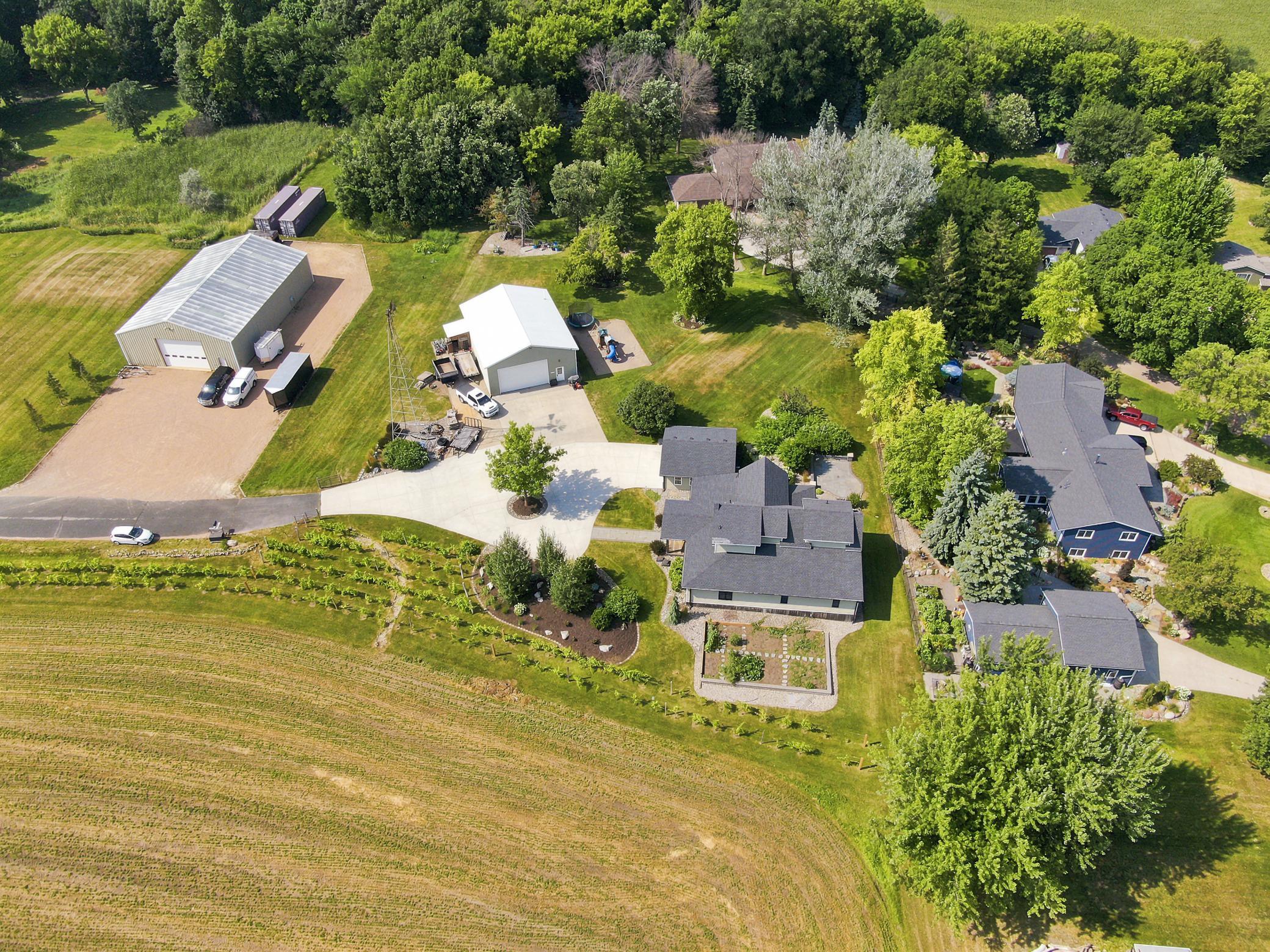 This breathtaking property features a beautifully updated home, a detached garage, a massive outbuilding, and its own private vineyard nestled on a sprawling lot with sweeping countryside views.