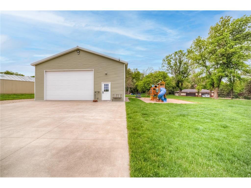 A massive outbuilding offers heated epoxy floors, incredible storage, full kitchen, bathroom with laundry , loft area, workshop space alongside a dedicated chicken coop.