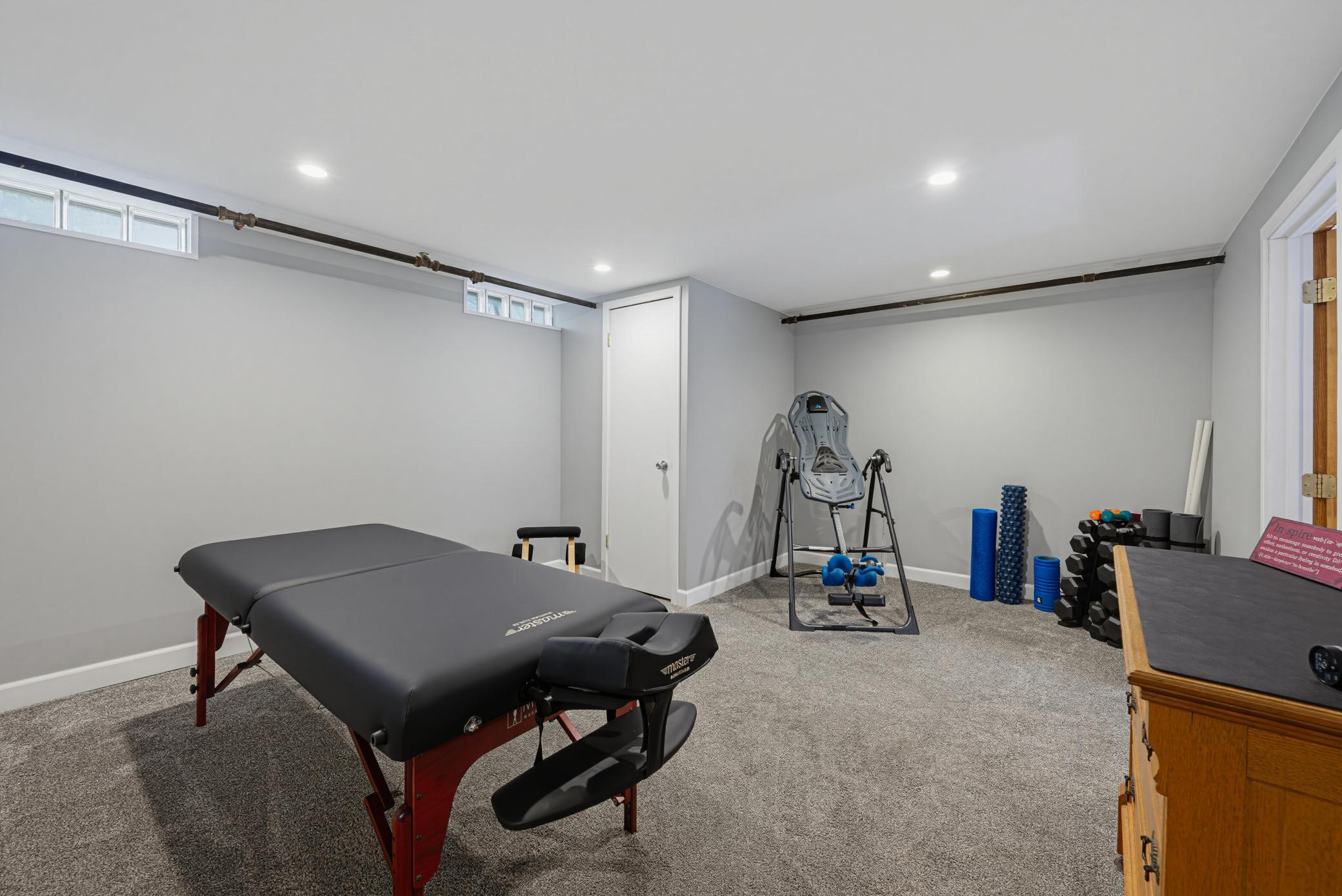 The recreation room in the lower level is currently being used as an exercise room.