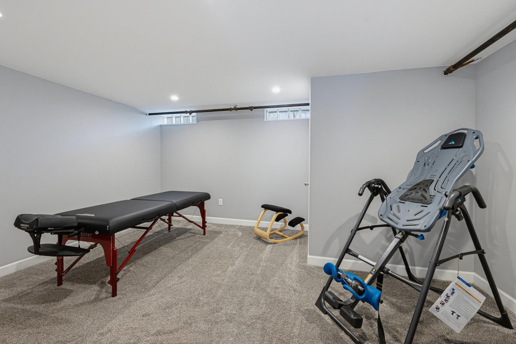 The recreation room in the lower level is currently being used as an exercise room.