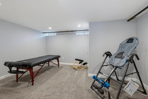 The recreation room in the lower level is currently being used as an exercise room.