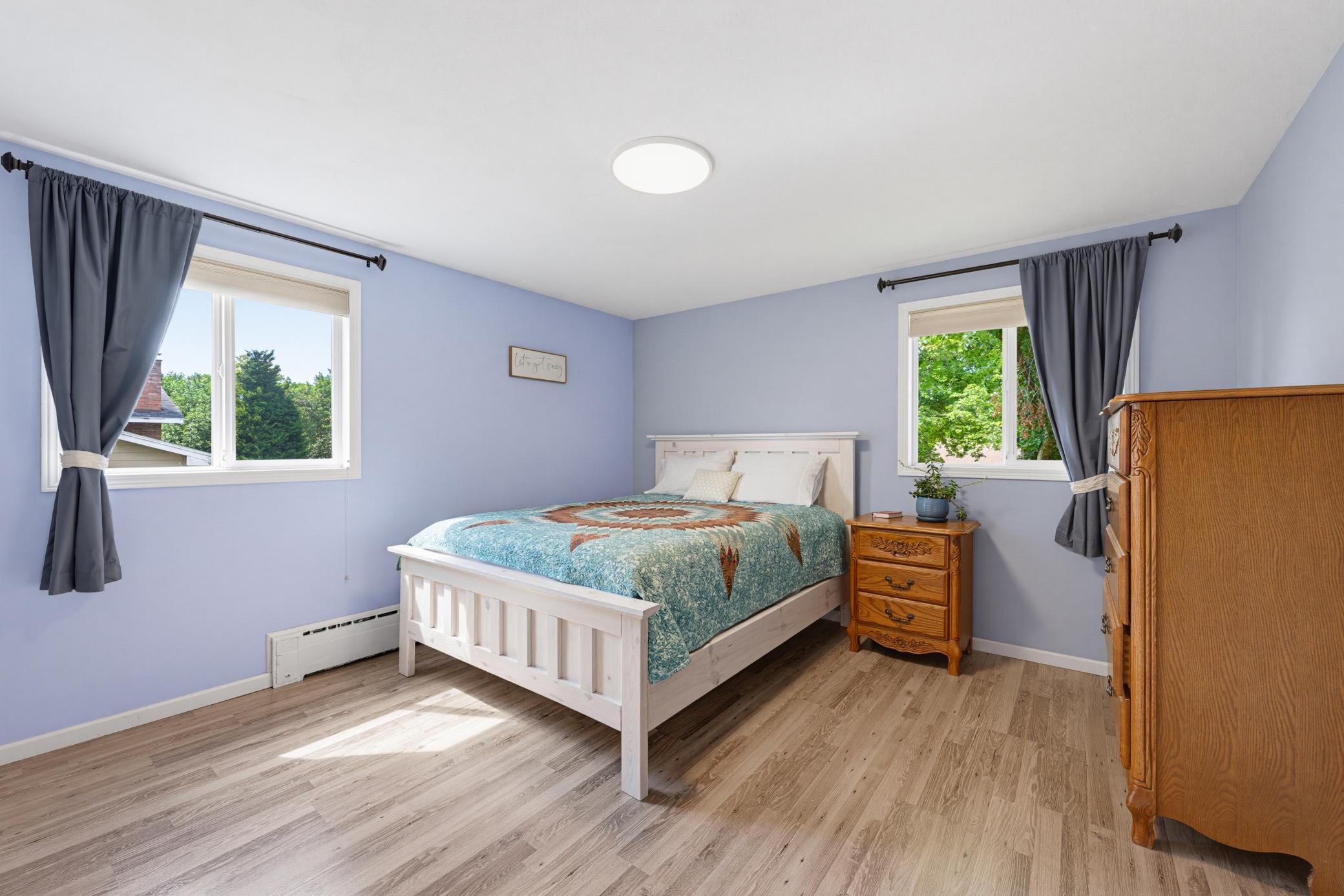 The second bedroom features durable LVP flooring.
