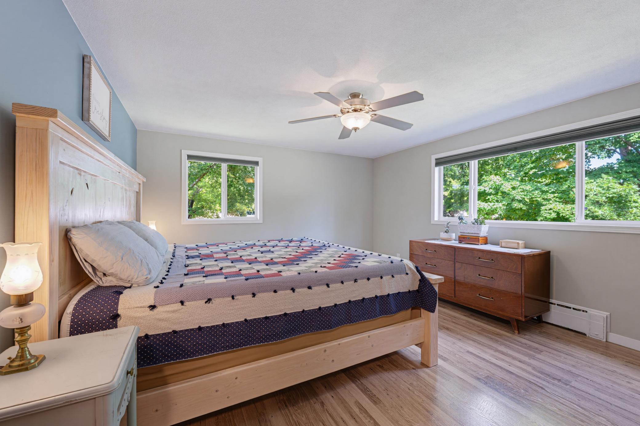 The primary bedroom features a walk-in closet and durable LVP flooring.