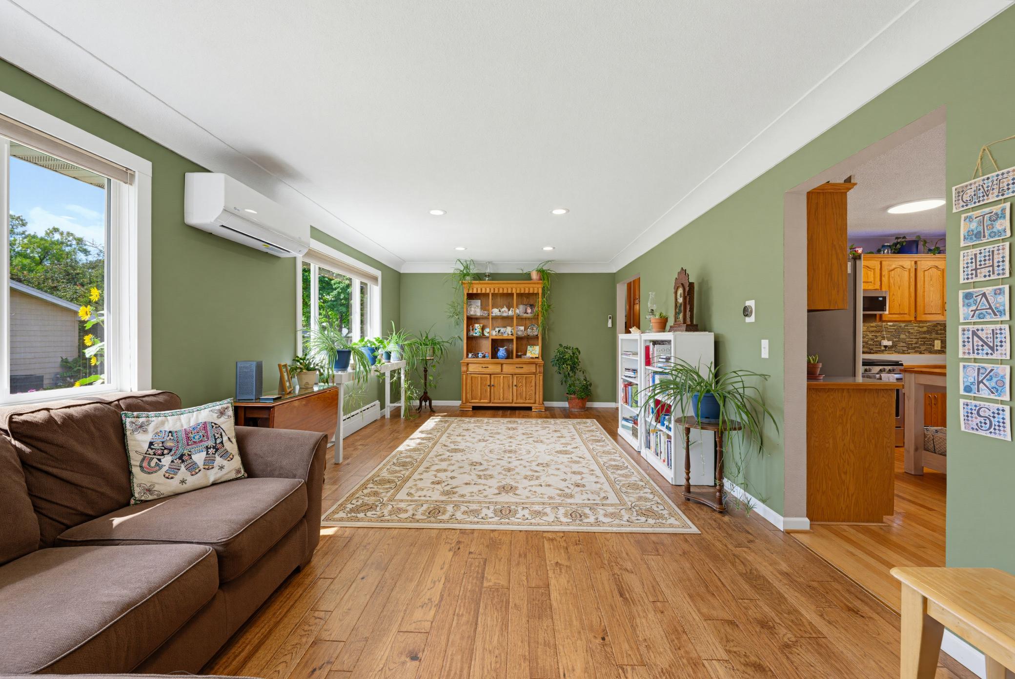 Situated right off of the kitchen, this expansive space could also be used as a formal dining room.