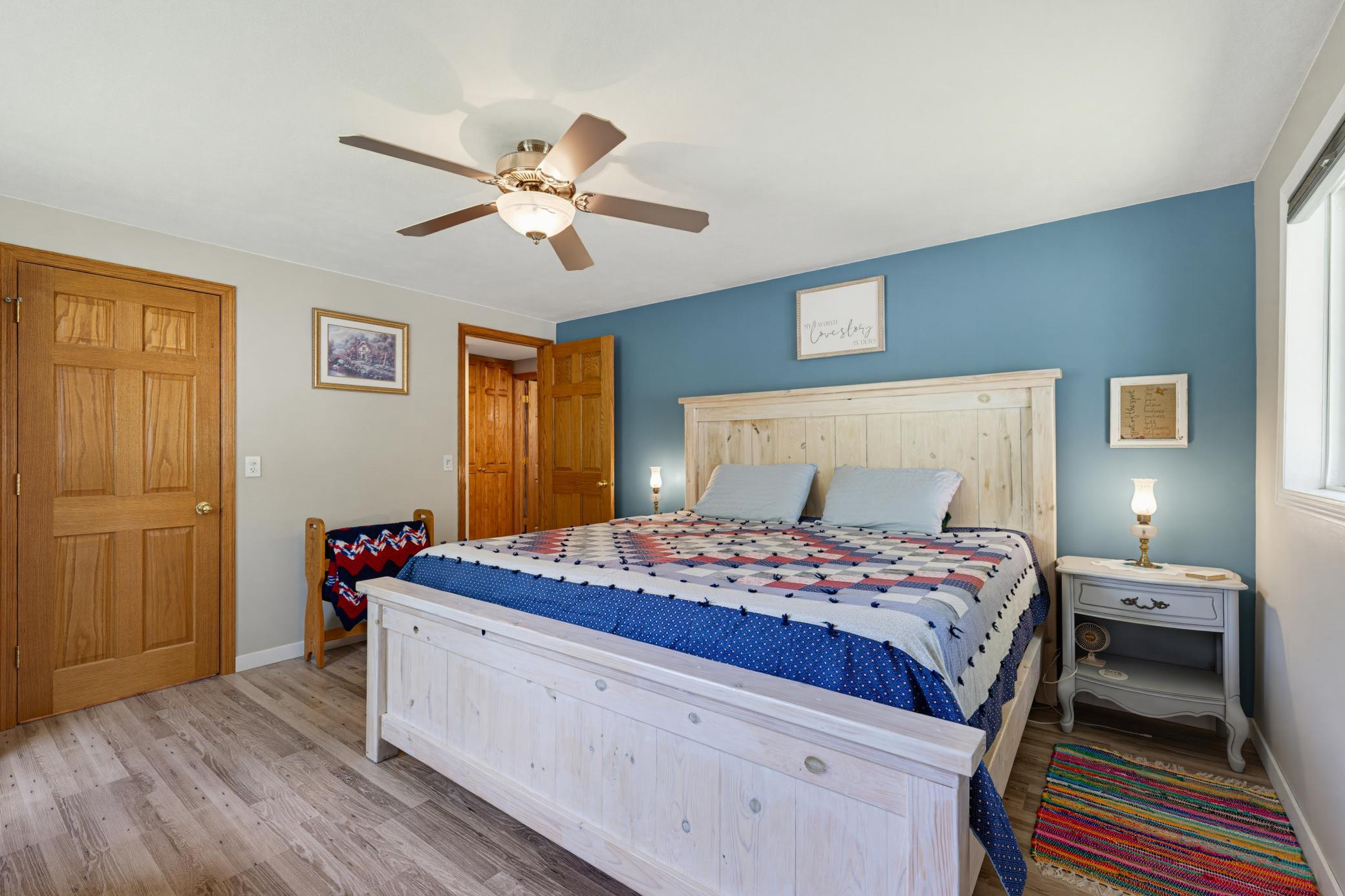 The primary bedroom features a walk-in closet and durable LVP flooring.