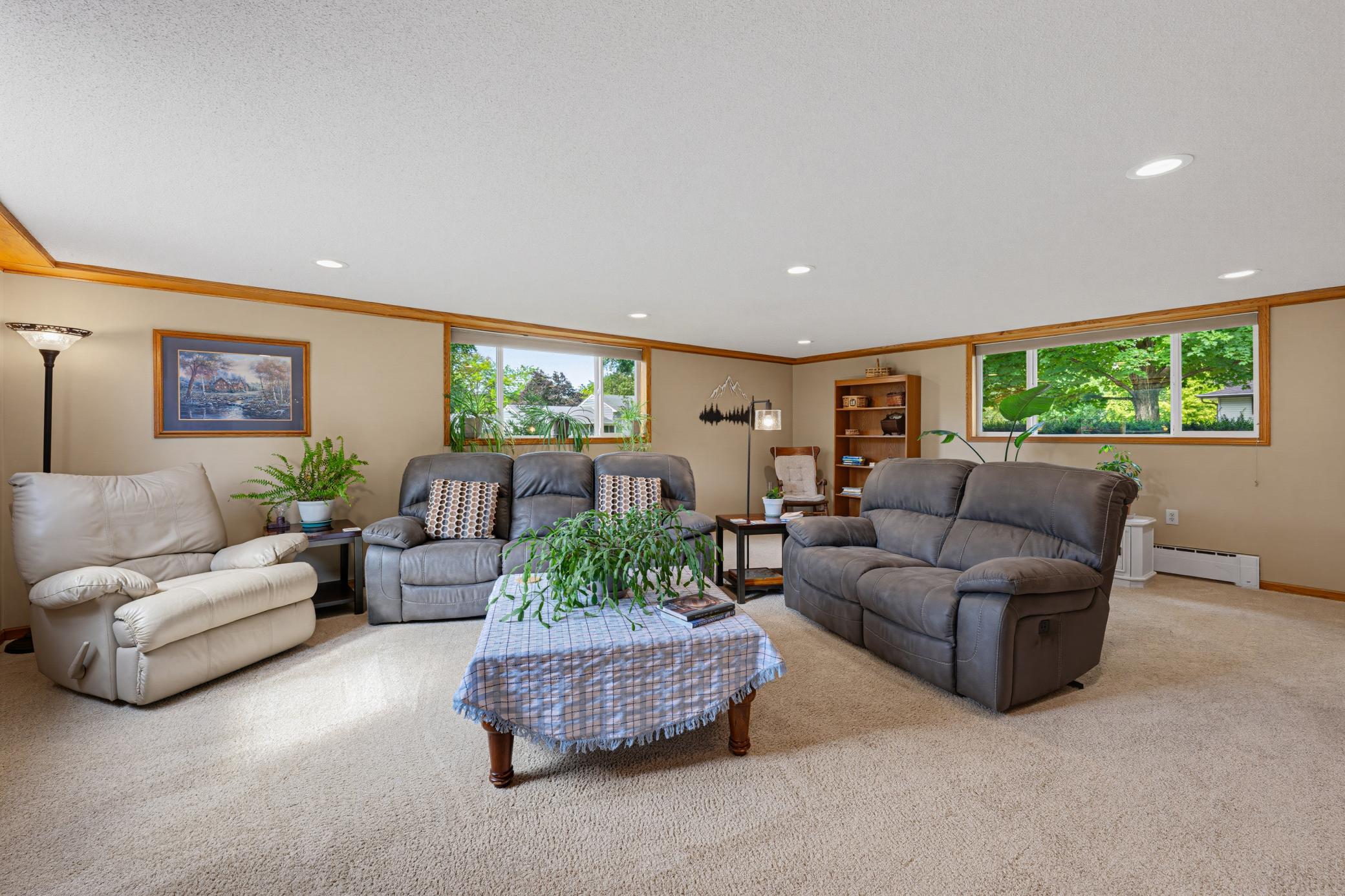 The family room features modern recessed canister lighting.