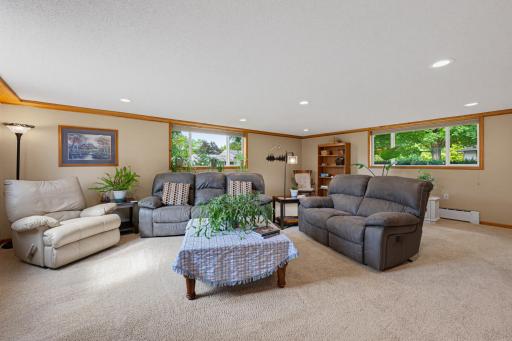 The family room features modern recessed canister lighting.