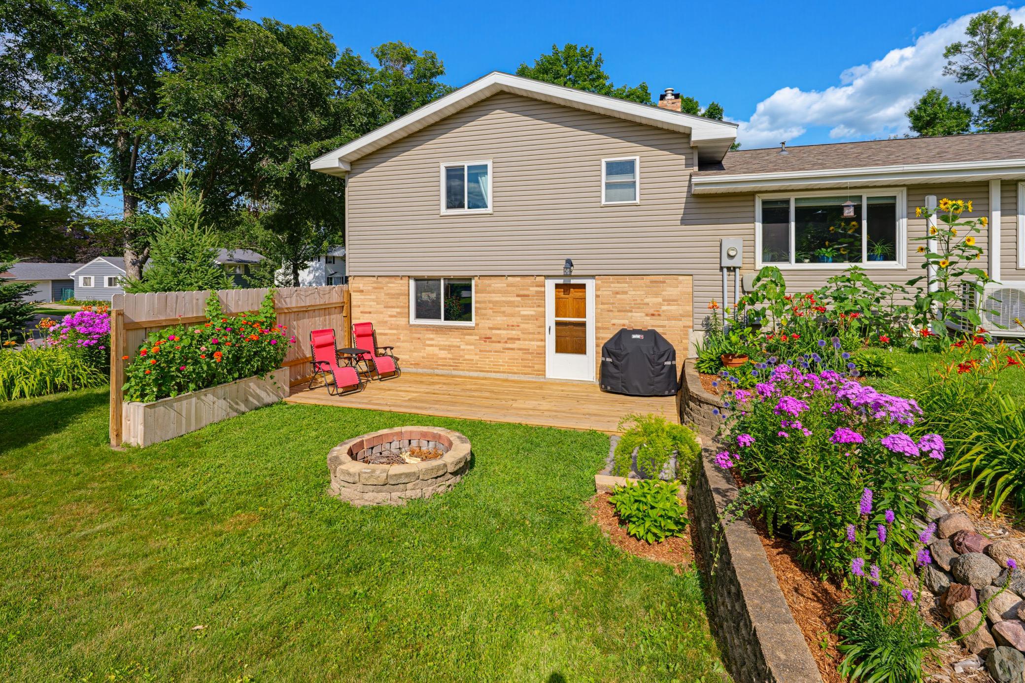Head out to the backyard, featuring a new (2026) deck and firepit area. Beautiful landscaping is featured all around this home.