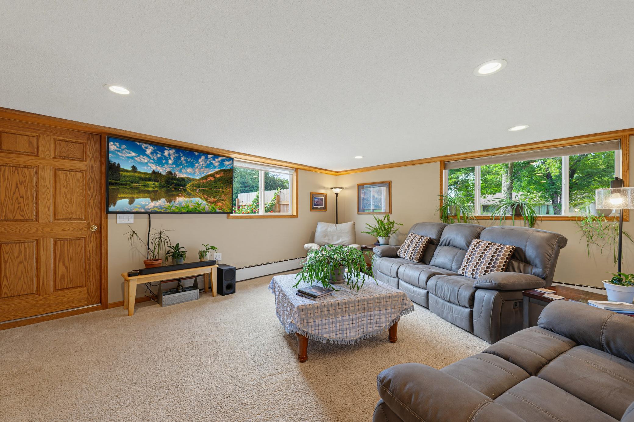 Head down to the family room, featuring a door that walks out to the spacious backyard.